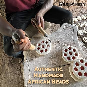 Person working with beads on a stone surface, with 'The Bead Chest' branding.